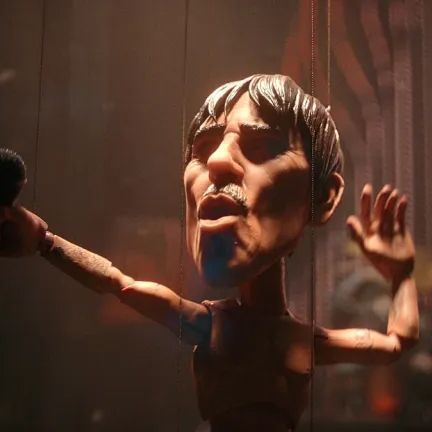 Close-up of the Anthony Kiedis marionette singing